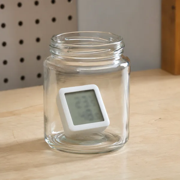 Mini hygrometer inside a glass jar